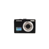 Samsung L100 digicam — vista frontal, disponible en LX-FILM
