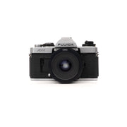 Fujica AX-1 + Tamron 28mm F2.5 slr film camera — front view, available at LX-FILM
