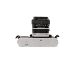 Nikkormat EL + Nikkor 50mm F1.4 câmara slr — vista angular, disponível na LX-FILM